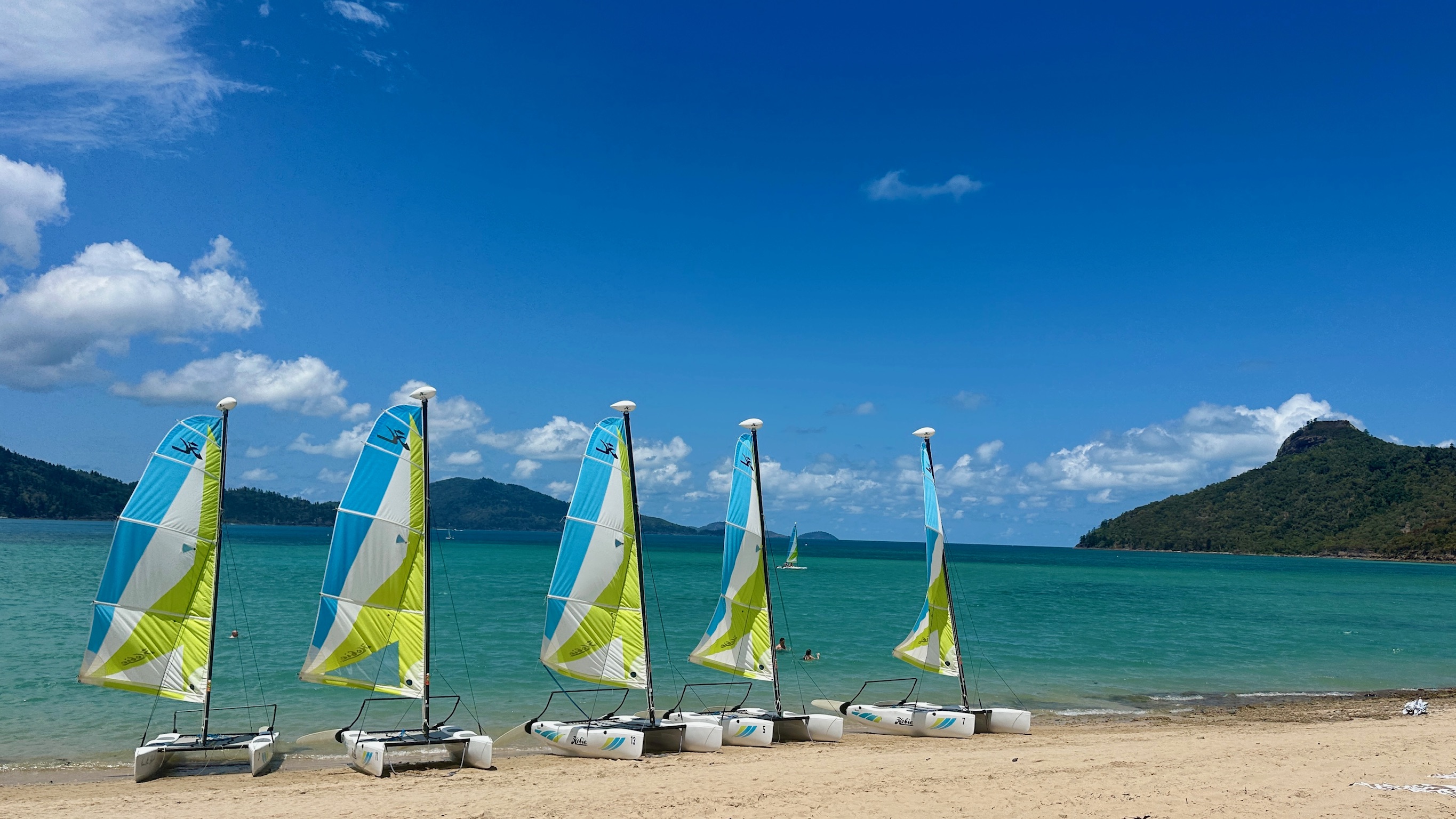 Catamarans drawn up on the sand, Hamilton Island, Queensland